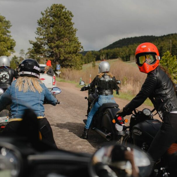 A back view of female motorcycle riders