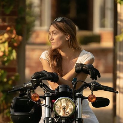 A female motorcyclists contemplating the meaning of life. Media sourced from Visordown.